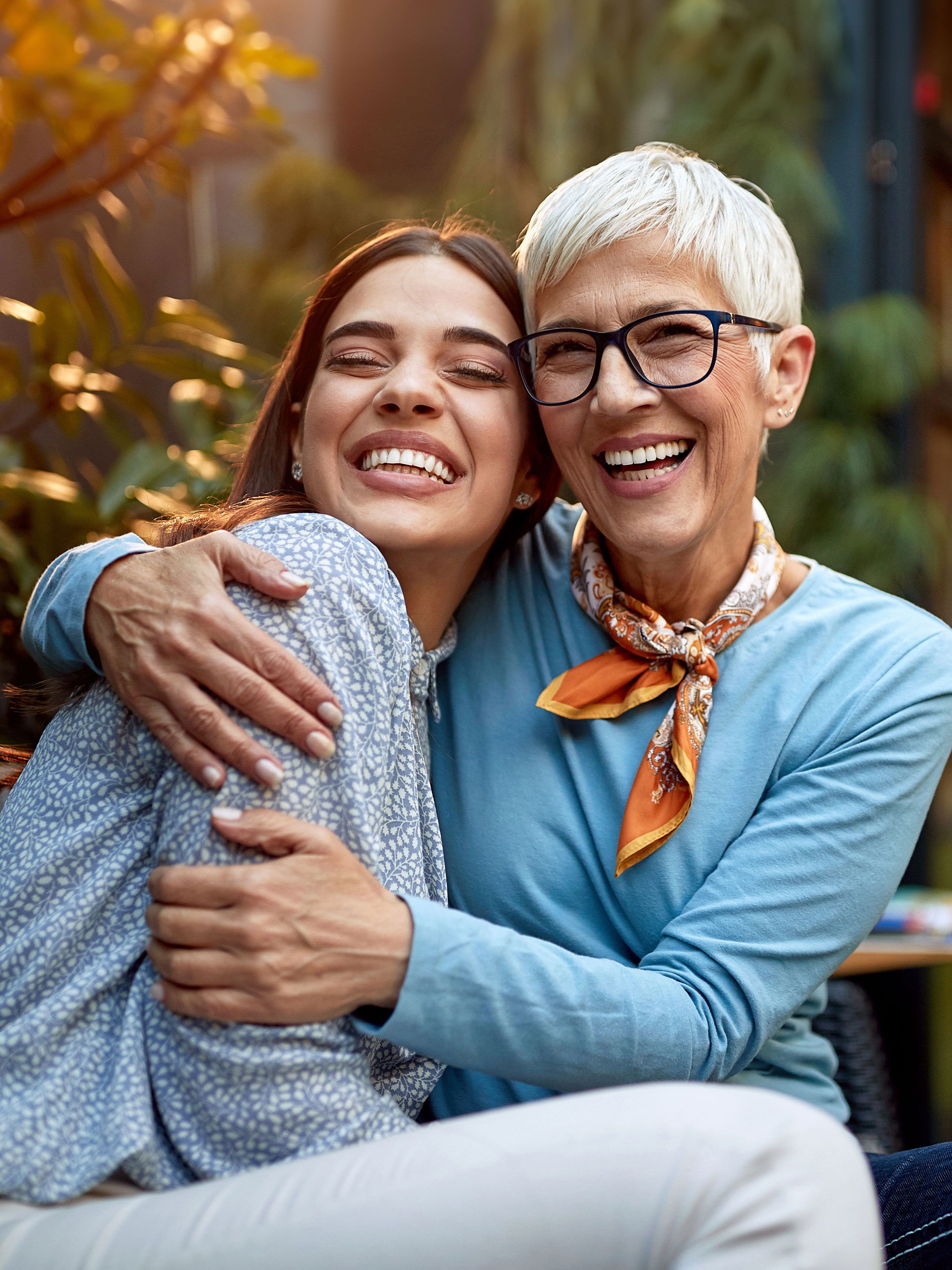 Two people smiling, one is dual eligible for Medicare and Medicaid.